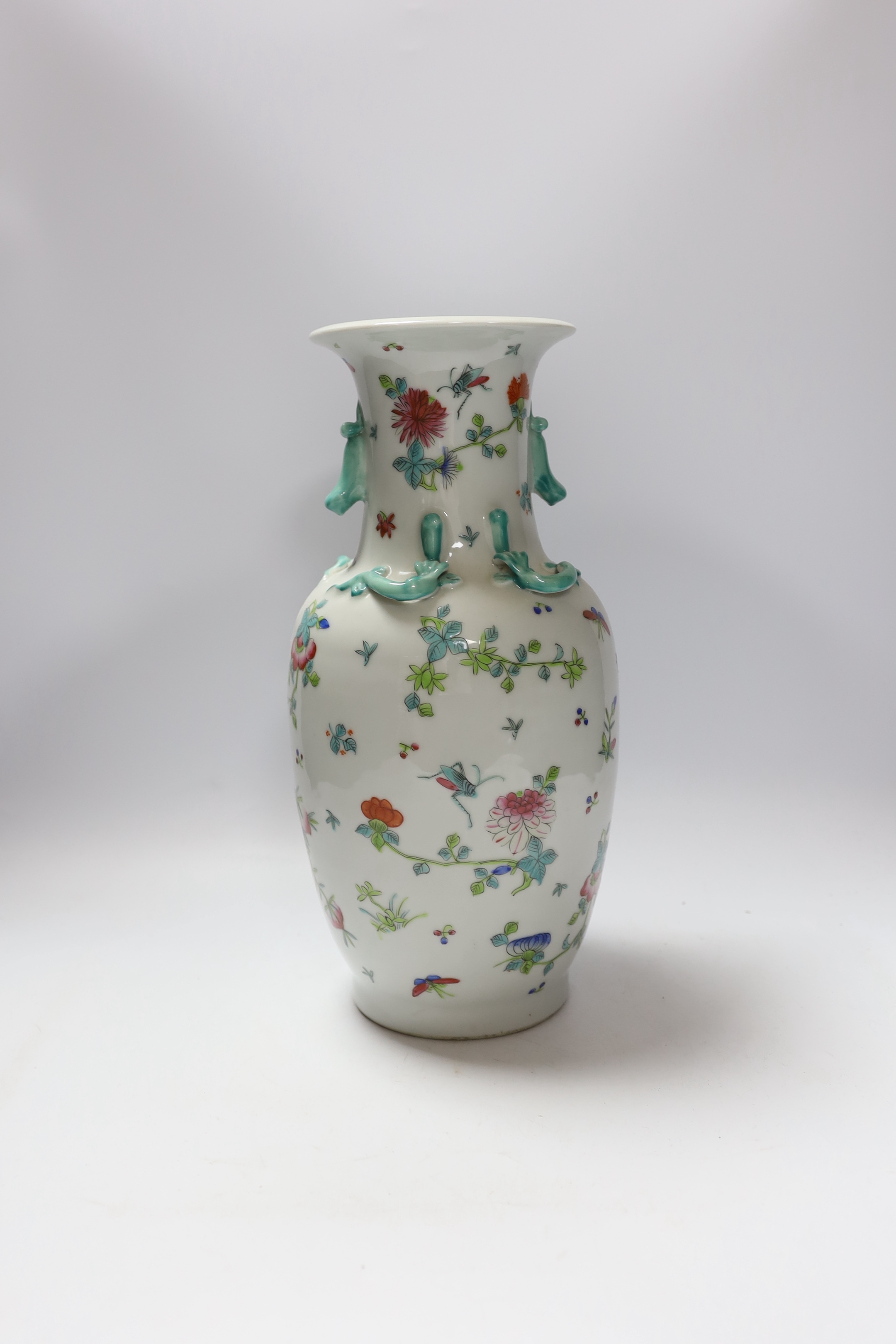 A Chinese famille rose vase, 20th century, with a drilled base, intended to be converted to a lamp, 36cm high